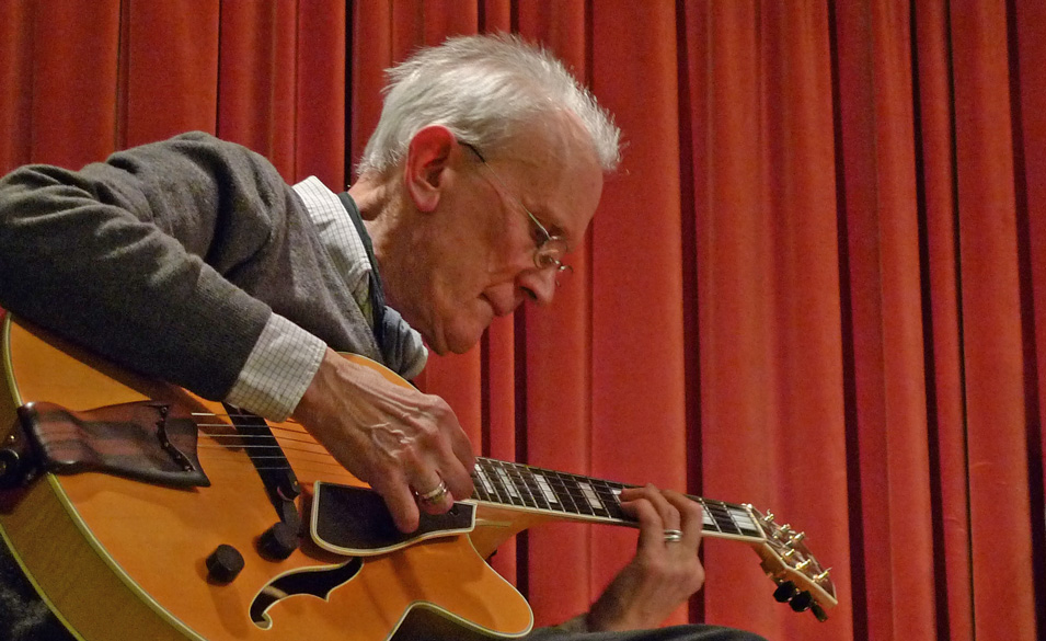 Malcolm Gibbons playing guitar